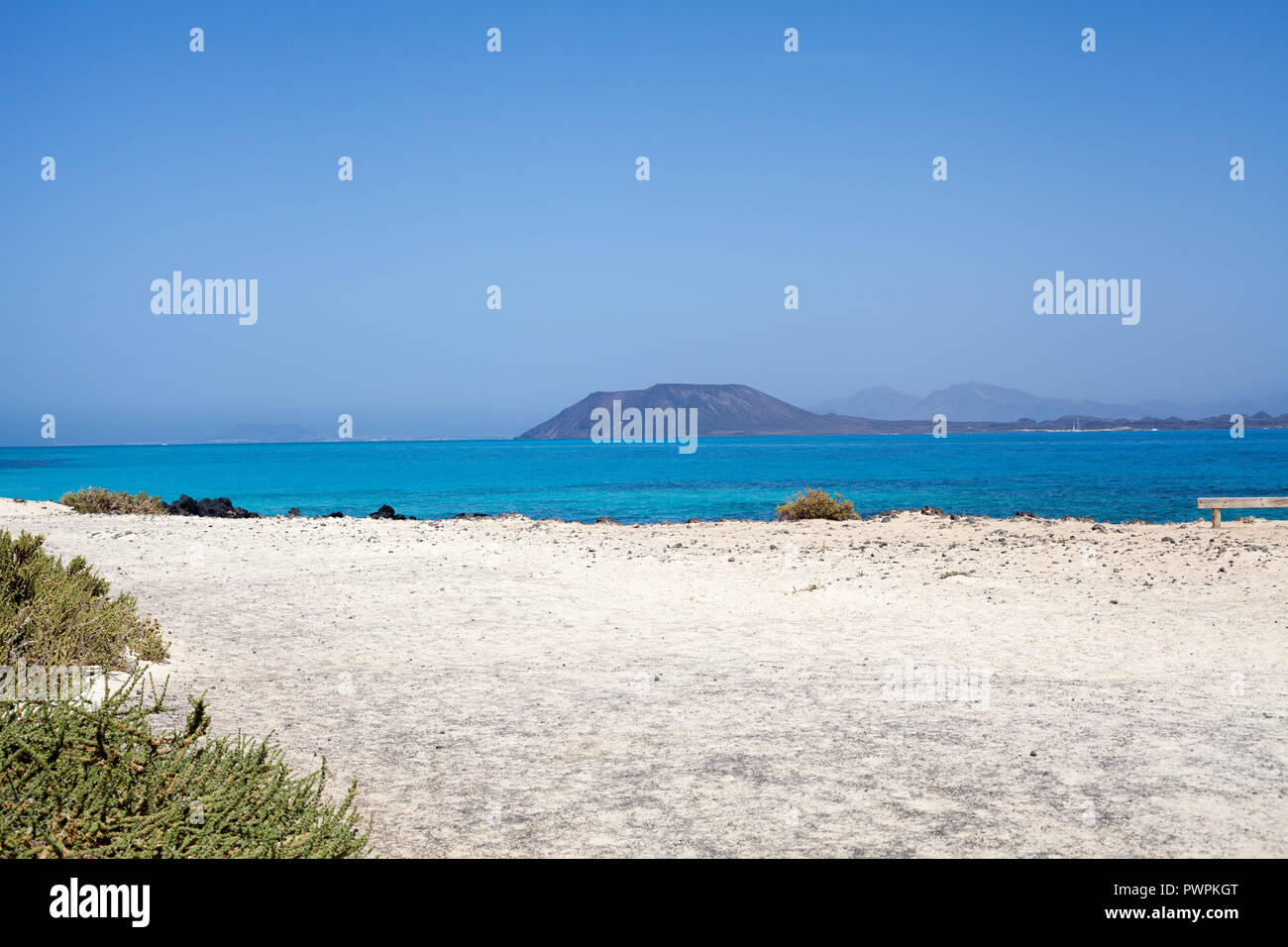 The tiny Island of Los Lobos and Lanzarote in the distance seen from Las Grandes Playas, Fuerteventura, Canary Islands, Spain Stock Photo