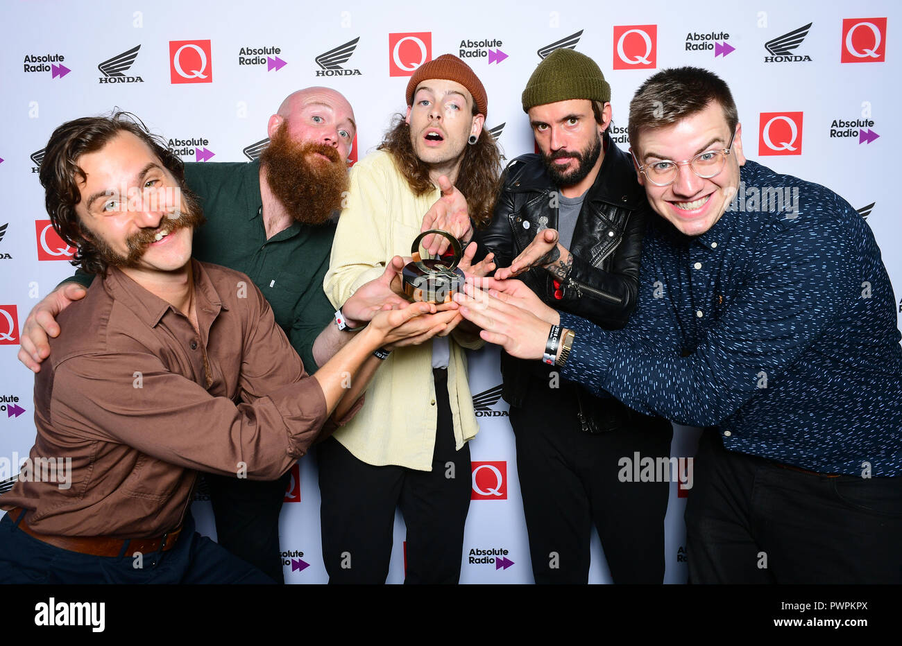 Joe Talbot, Adam Devonshire, Mark Bowen, Lee Kiernan and Jon Beavis of Idles winners of the Q Breakthrough Award in the press room during the Q Awards 2018 in association with Absolute Radio at the Camden Roundhouse, London. Stock Photo