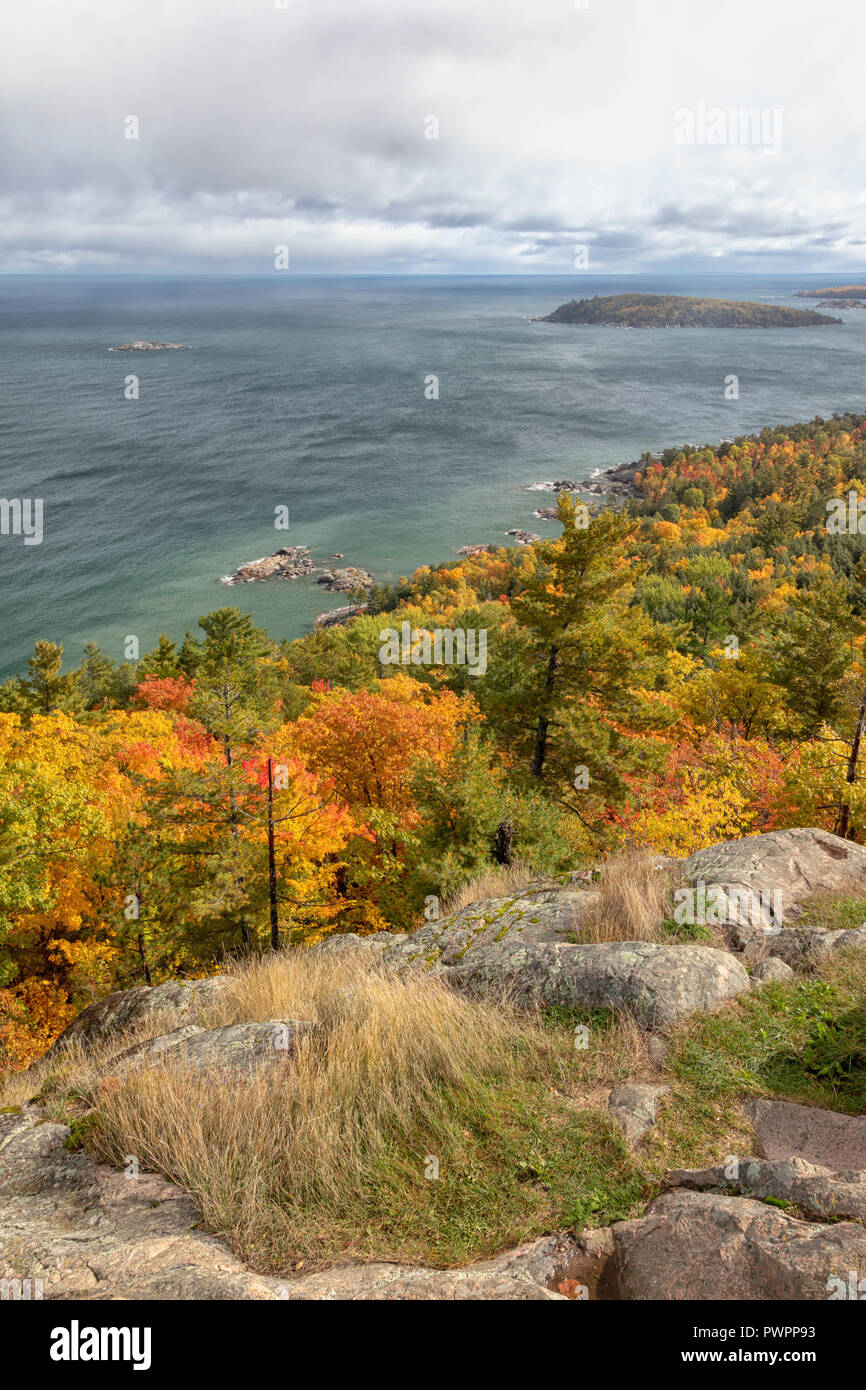 A view over autumn colors and Lake Superior from Sugarloaf Mountain near Marquette Michigan Stock Photo