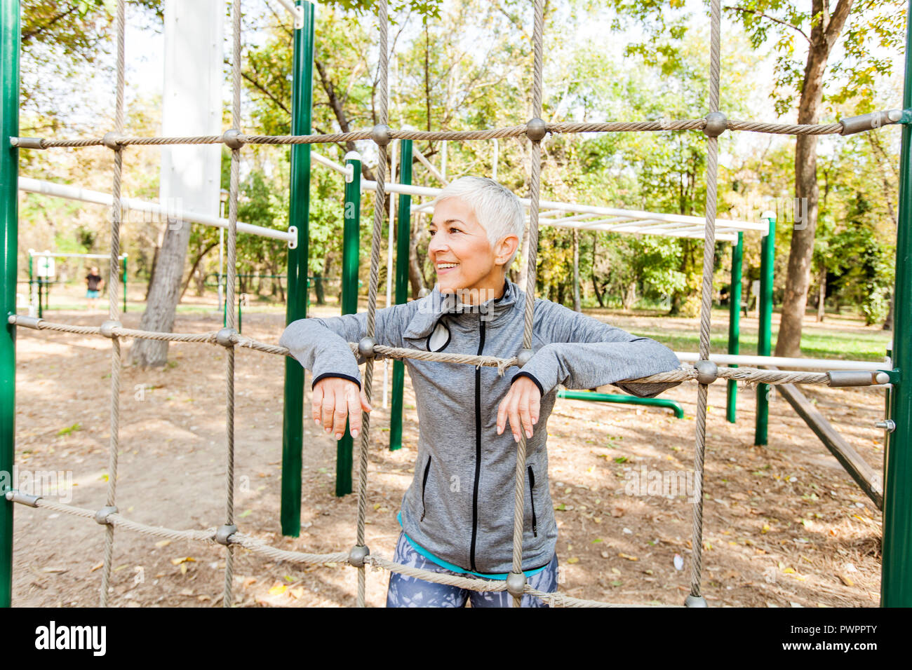 Fit Senior Woman Exercise At Outdoor Gym Sports Clothes Sporty