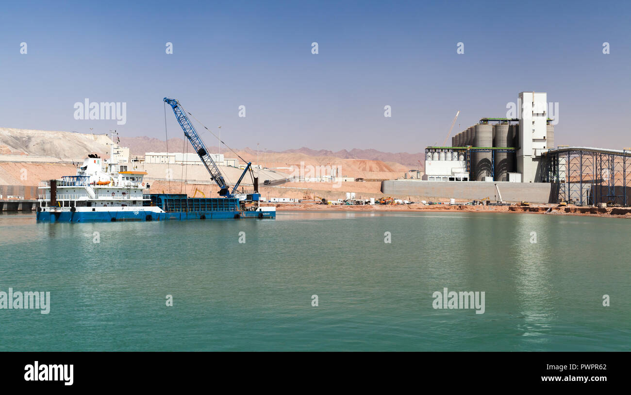 Aqaba, Jordan - May 17, 2018: Dredging works in new Aqaba port, Jordan. Blue deck cargo ship Stock Photo