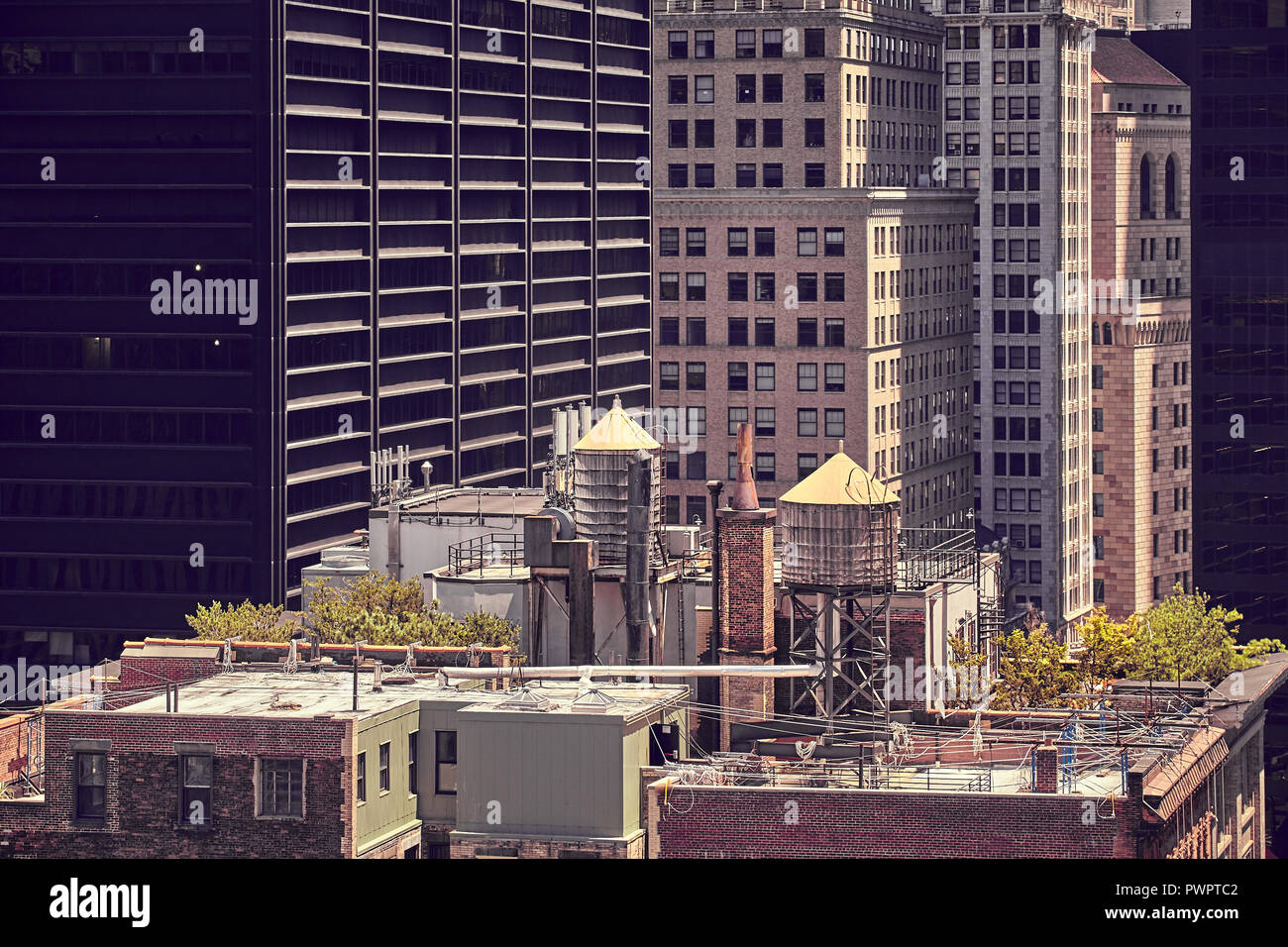 Vintage toned picture of water tanks on a rooftop, New York City, USA