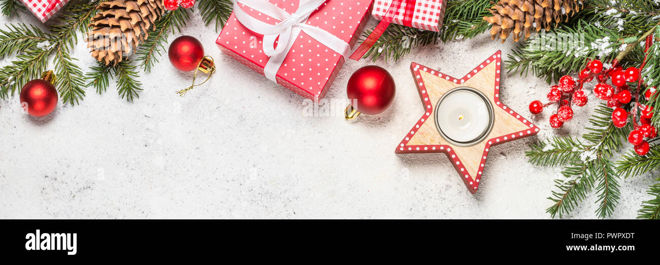 Christmas background with fir tree, candle and decorations on wh Stock ...