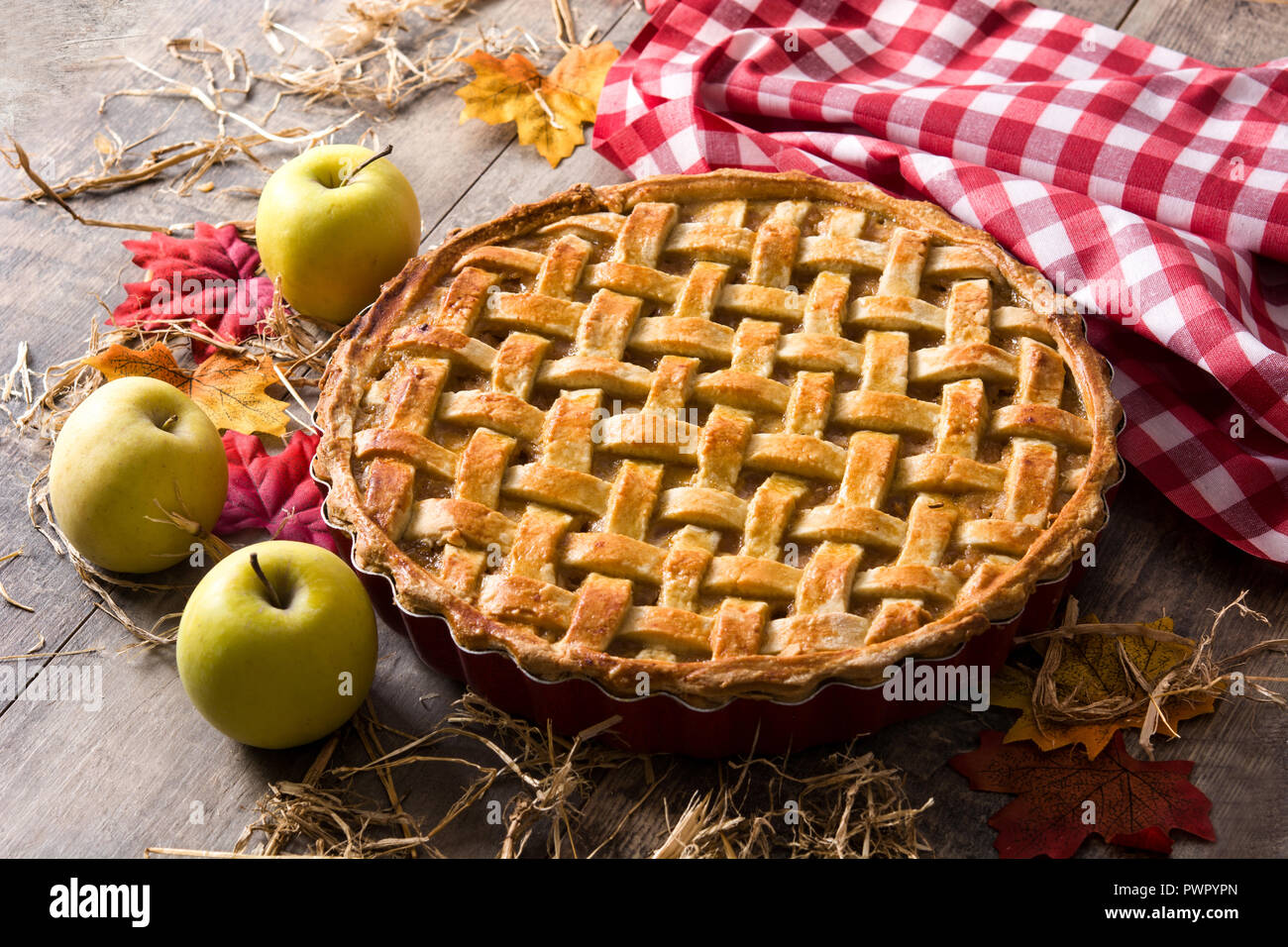 Homemade traditional apple pie on wooden table. Stock Photo