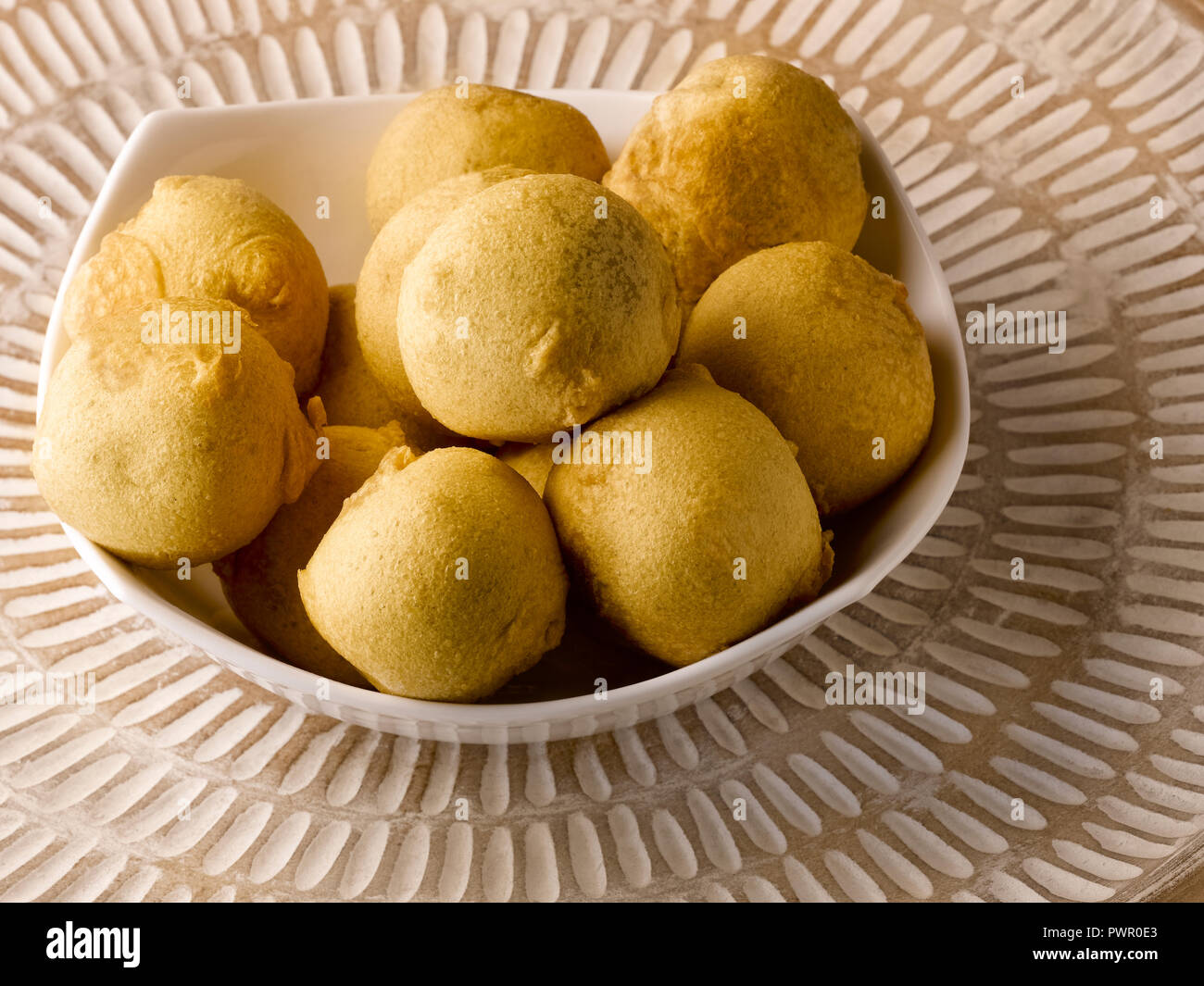 BATATA WADA, POTATOES COVERED WITH GRAM FLOUR, DEEP FRIED Stock Photo