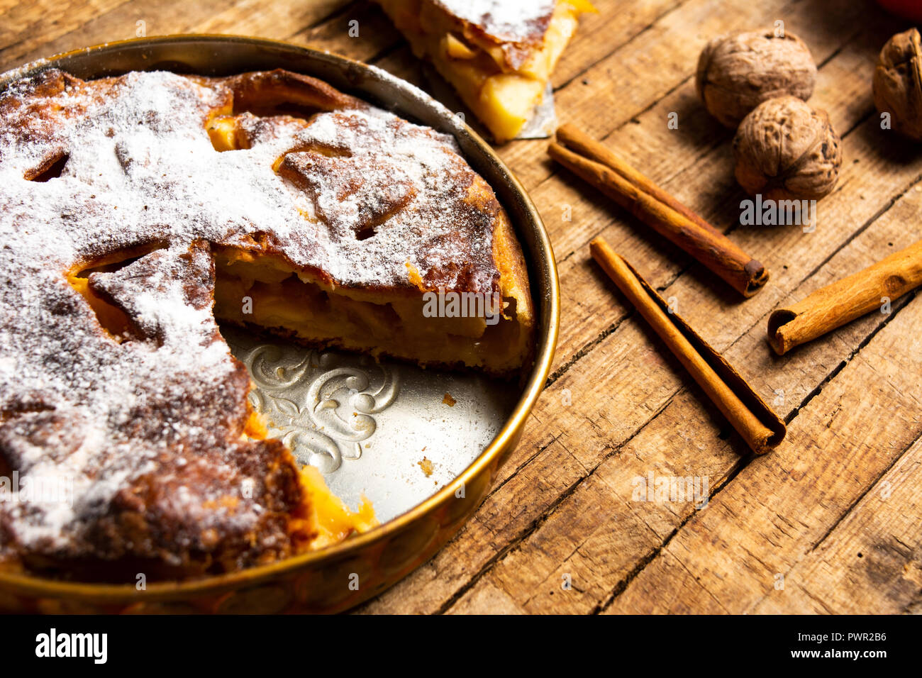 Homemade apple pie with cinnamon on a table Stock Photo