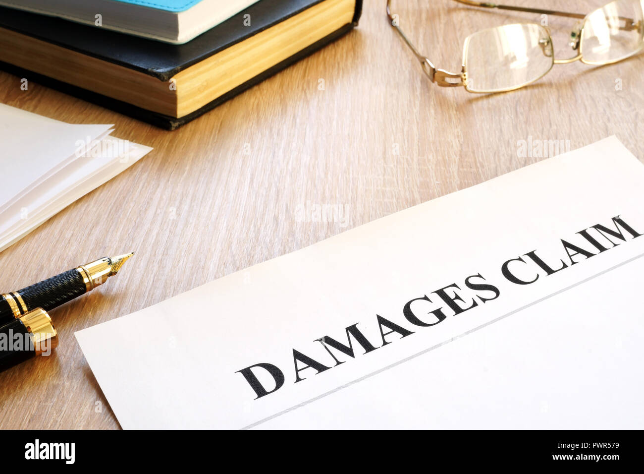 Damages claim form and pen. Insurance concept. Stock Photo