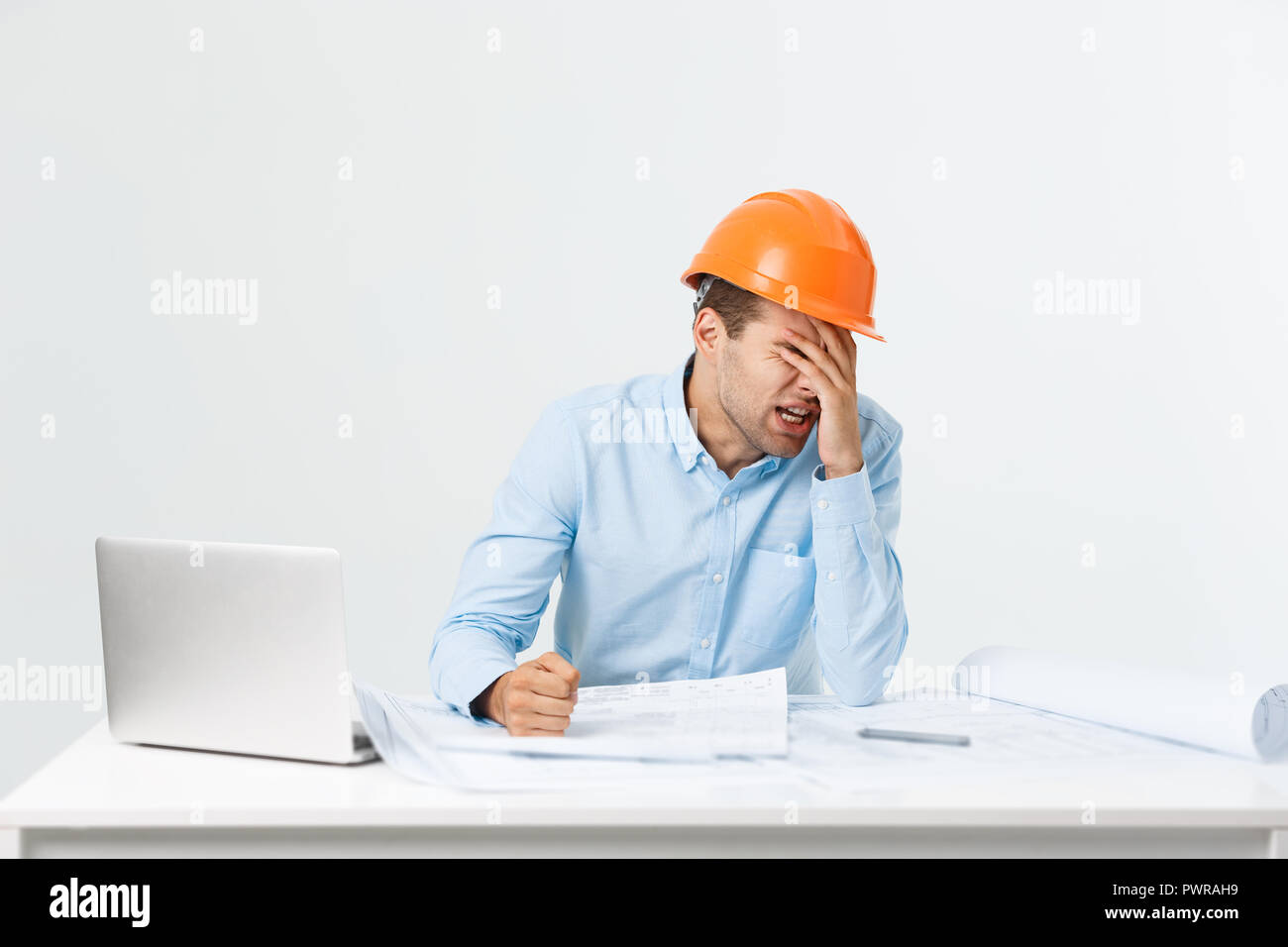 Young workman annoyed angry in furious gesture. Negative expression on ...