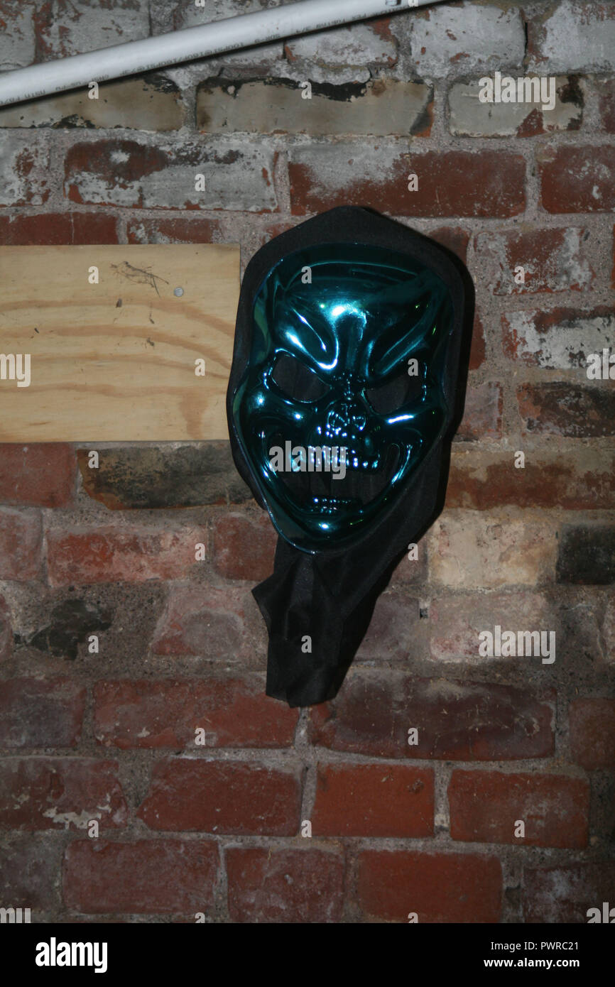 Mask Hanging in Cellar Stock Photo