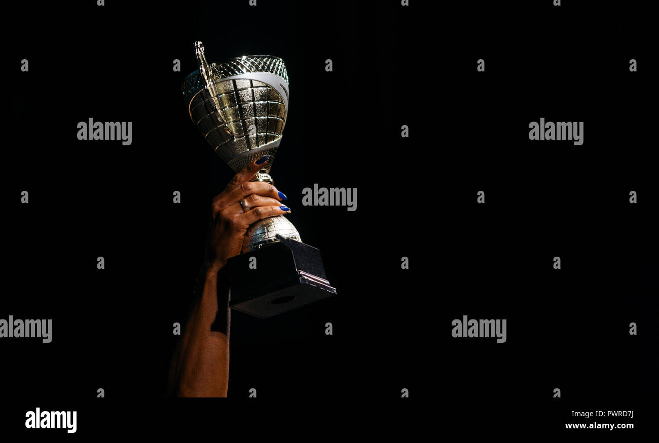 women athletes with Cup winner in competition Stock Photo Alamy