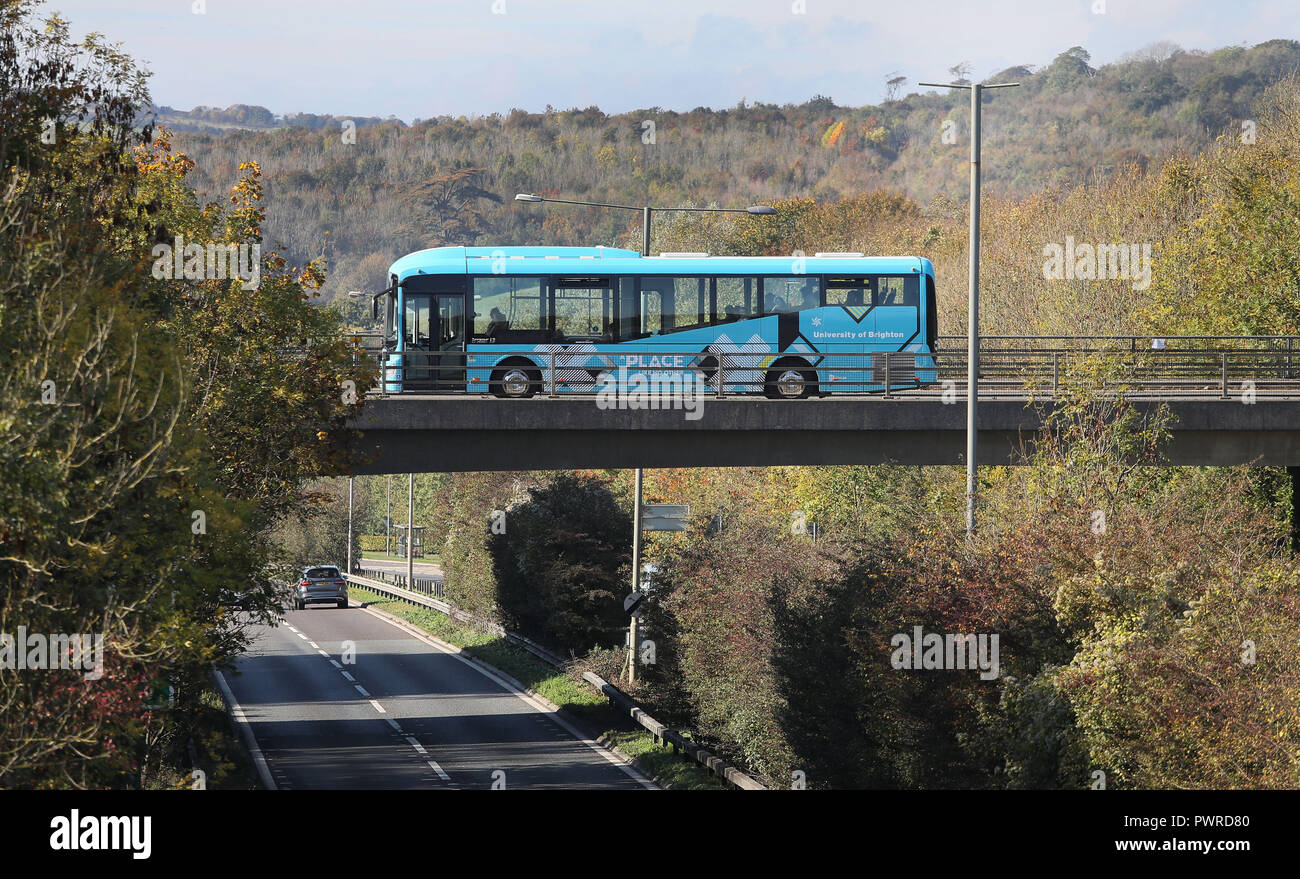 University of Brighton Shuttle Bus UB1 passes over the A27 on route to the Falmer Campus. 16 October 2018. Stock Photo