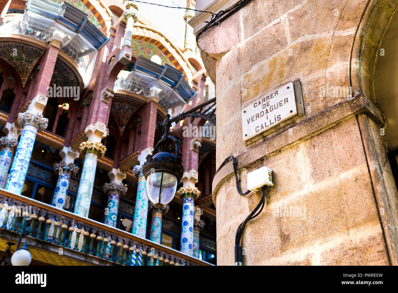 Sign for Carrer De Verdaguer street with Palau de la Música Catalana in the background, Barcelona, Spain Stock Photo