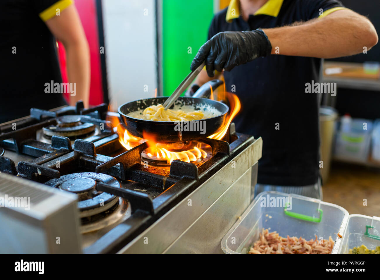 cooking pasta in a frying pan Stock Photo Alamy