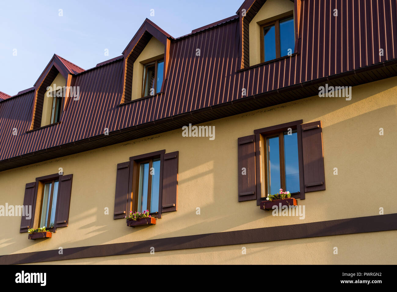 windows with shutters and pots for flowers Stock Photo