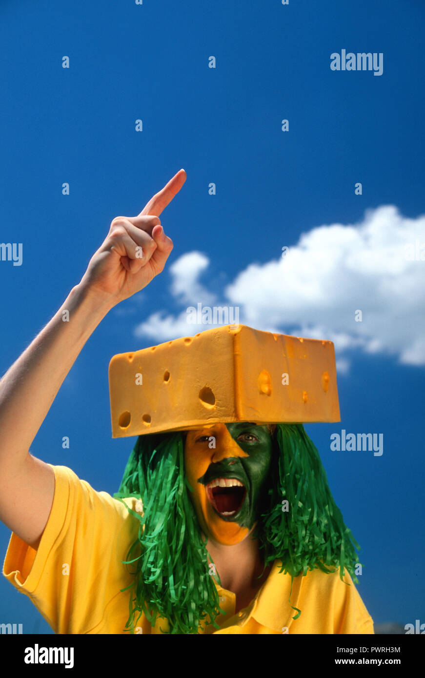 Enthusiastic Cheesehead Sports Fan with Painted Face at a Football Game in  Green Bay, Wisconsin, USA Stock Photo - Alamy