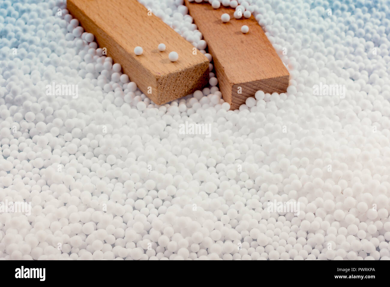 Wooden blocks in White polystyrene foam balls as background Stock Photo ...