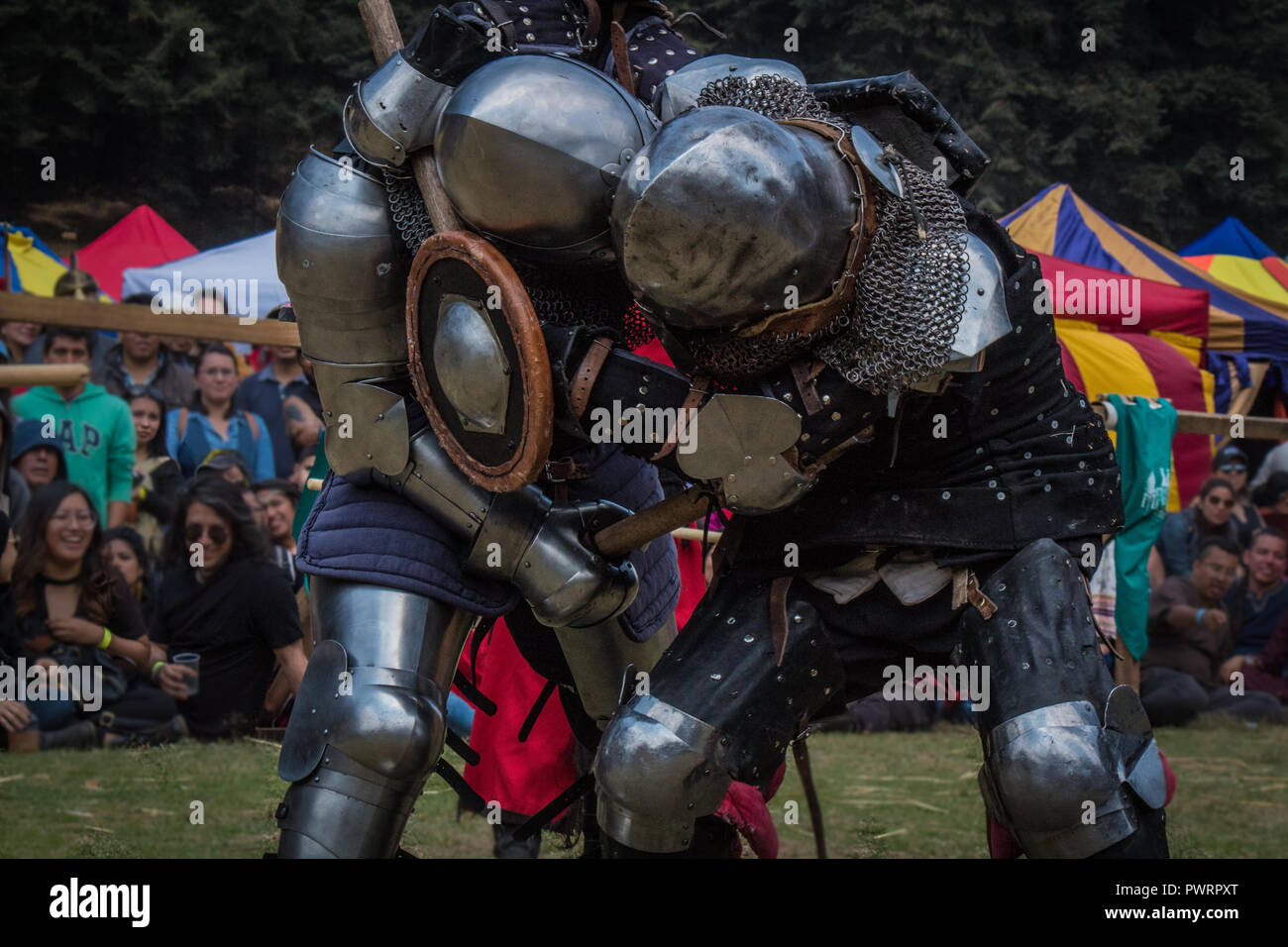 Medieval knights fighting with armor, swords and shields in festival Stock Photo