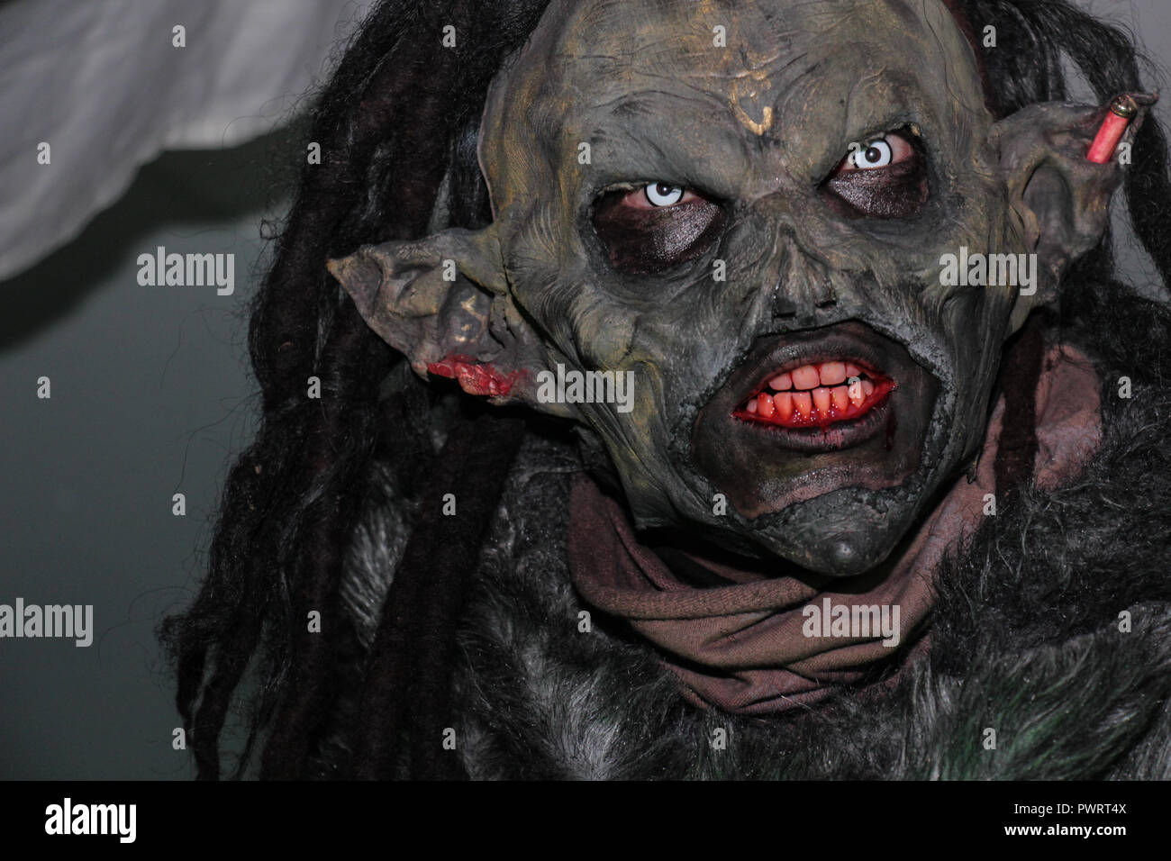 Terrifying portrait of wild orc in medieval festival Stock Photo