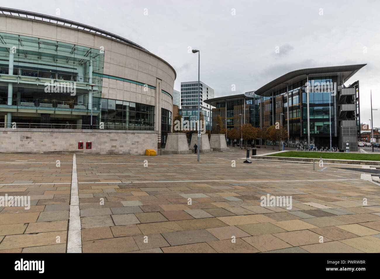 Waterfront Hall, an entertainment venue for concerts, conferences, music etc on left and The Soloist Building on right in Lanyon Place, Belfast, N.Ire Stock Photo