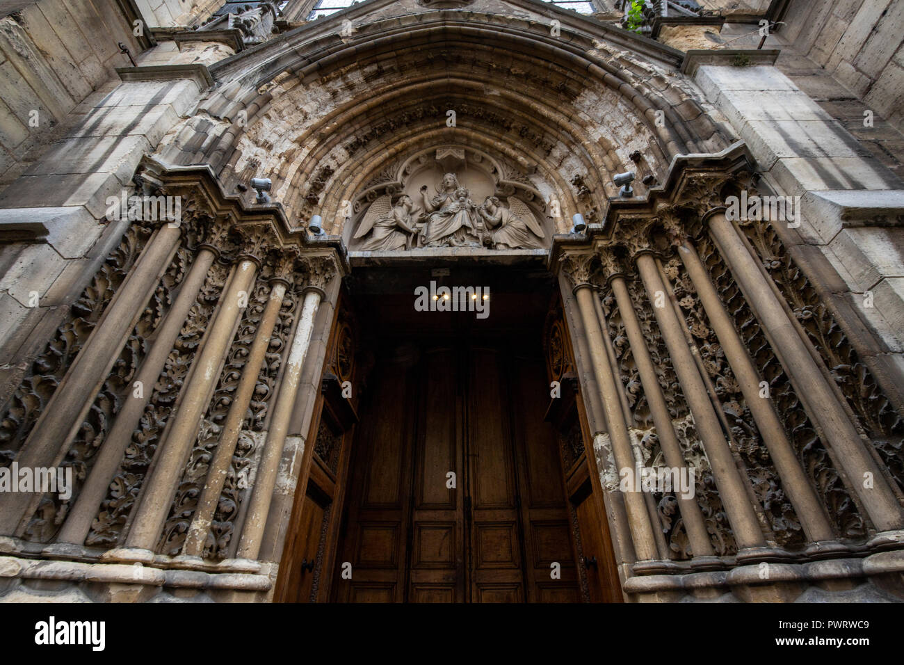 Ornate Paris Door at Saint Severin - Thousands of doors and gates adorn buildings in Paris.  Some of the best are on government offices, cathedrals an Stock Photo