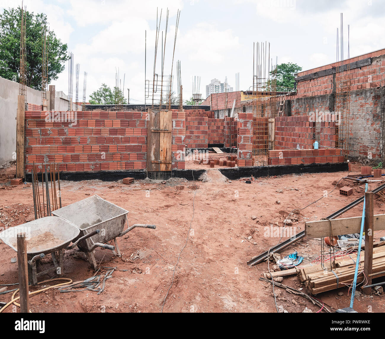 Construction, land under construction of a masonry house. Structure of