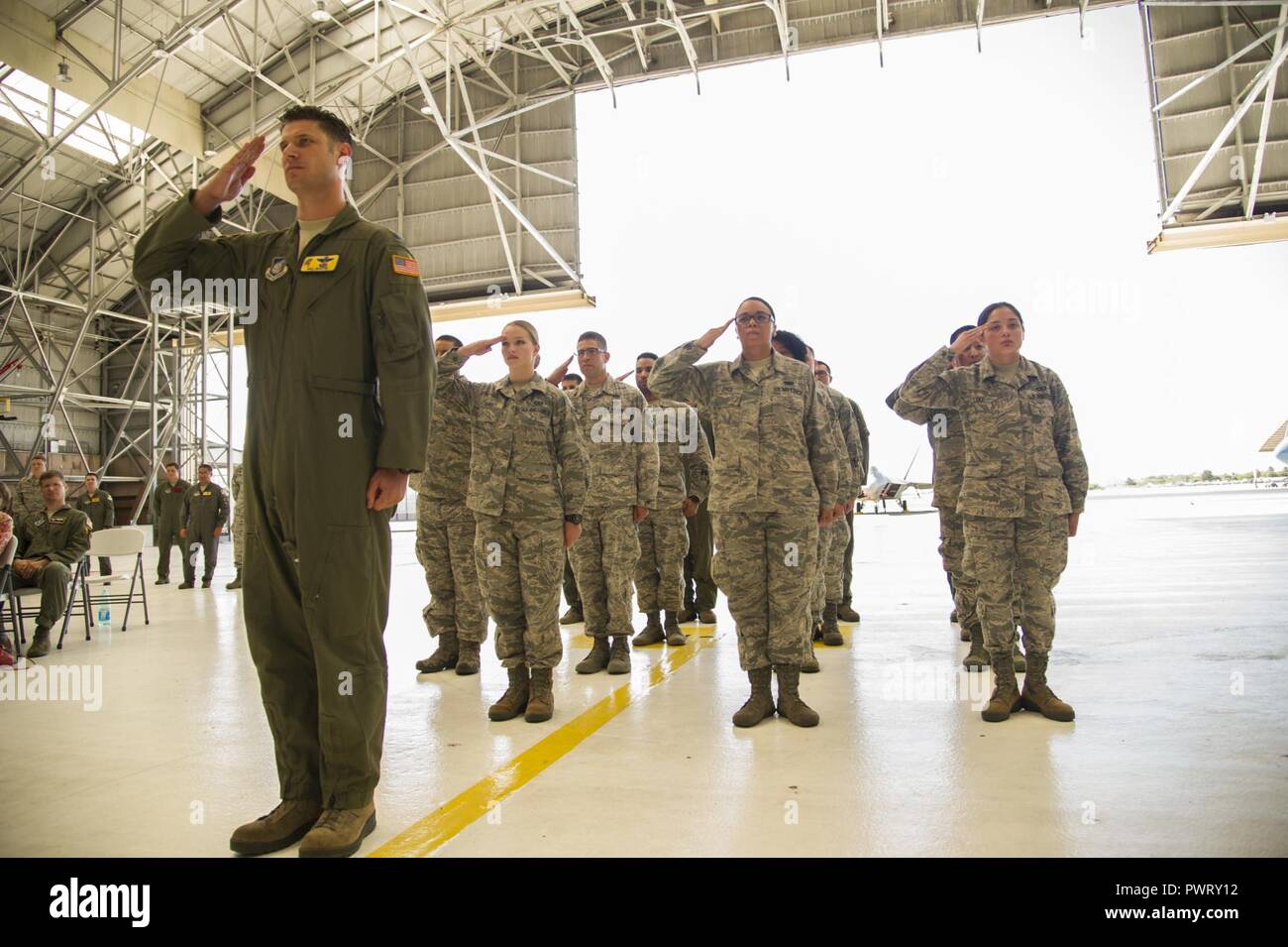 The men and women of the 15th Operations Group give their final salute ...