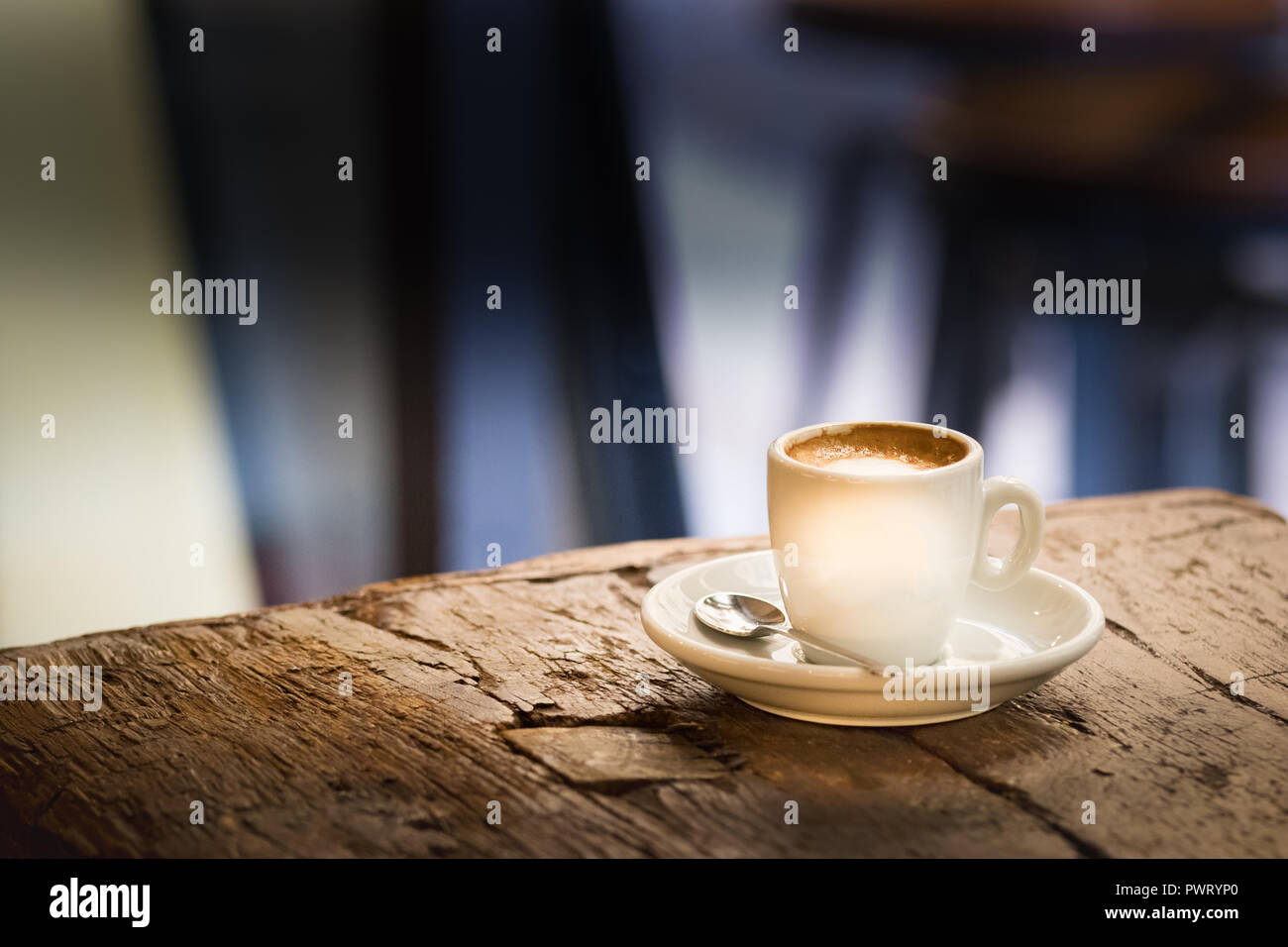 https://c8.alamy.com/comp/PWRYP0/a-small-espresso-coffee-cup-white-with-plate-and-spoon-on-a-rustic-wooden-table-outdoors-PWRYP0.jpg