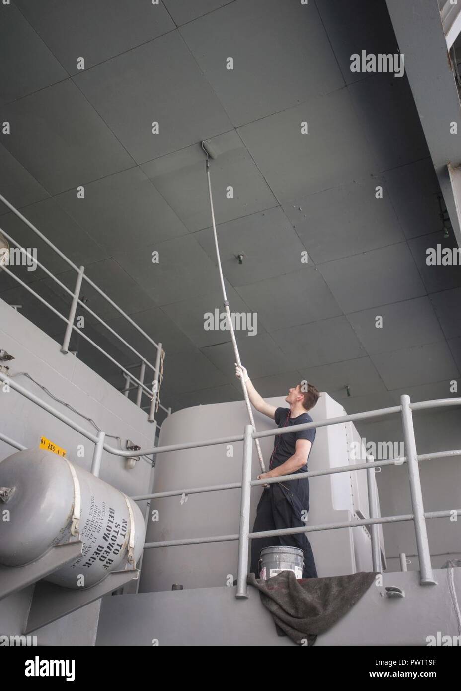 MEDITERRANEAN SEA (June 26, 2017) Seaman Robert Mucka repaints the overhead on the fantail of the aircraft carrier USS George H.W. Bush (CVN 77) (GHWB). GHWB, part of the George H.W. Bush Carrier Strike Group (GHWBCSG), is conducting naval operations in the U.S. 6th Fleet area of operations in support of U.S. national security interests in Europe and Africa. ( Stock Photo