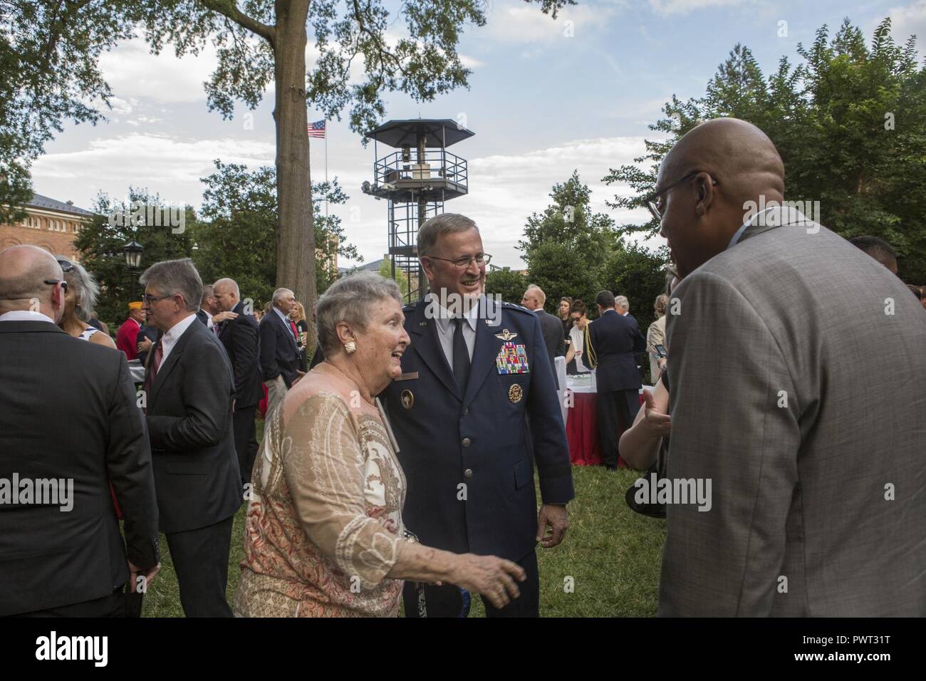 U.S. Air Force Lt. Gen. Thomas J. Trask, vice commander of Headquarters U.S. Special Operations Command (SOCOM), speaks with guests during a reception before an evening parade at Marine Barracks Washington, Washington, D.C., June 23, 2017. Evening parades are held as a means of honoring senior officials, distinguished citizens and supporters of the Marine Corps. Stock Photo