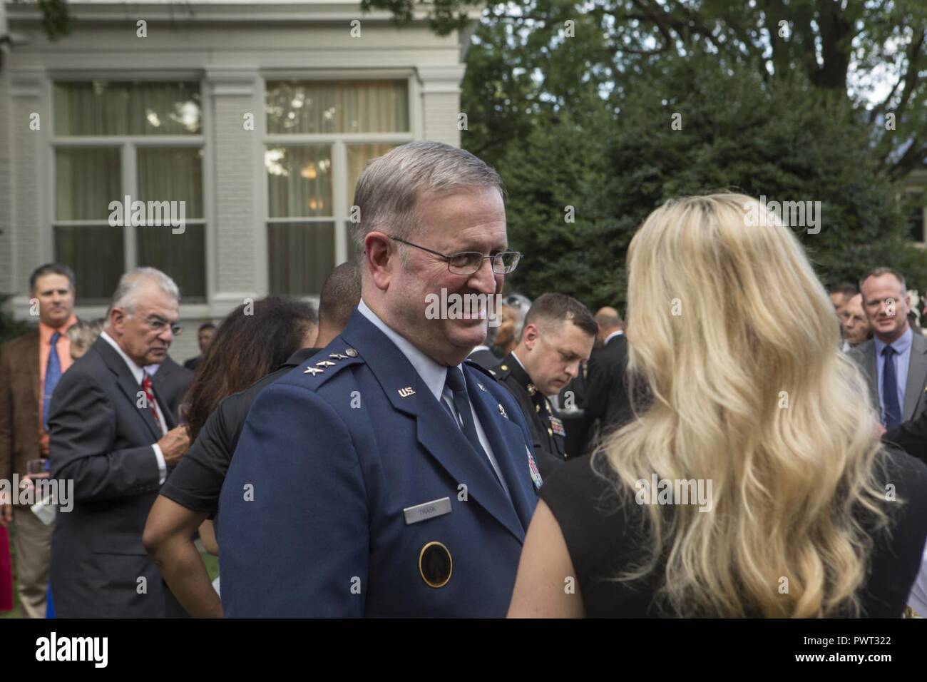 U.S. Air Force Lt. Gen. Thomas J. Trask, vice commander of Headquarters U.S. Special Operations Command (SOCOM), speaks with guests during a reception before an evening parade at Marine Barracks Washington, Washington, D.C., June 23, 2017. Evening parades are held as a means of honoring senior officials, distinguished citizens and supporters of the Marine Corps. Stock Photo