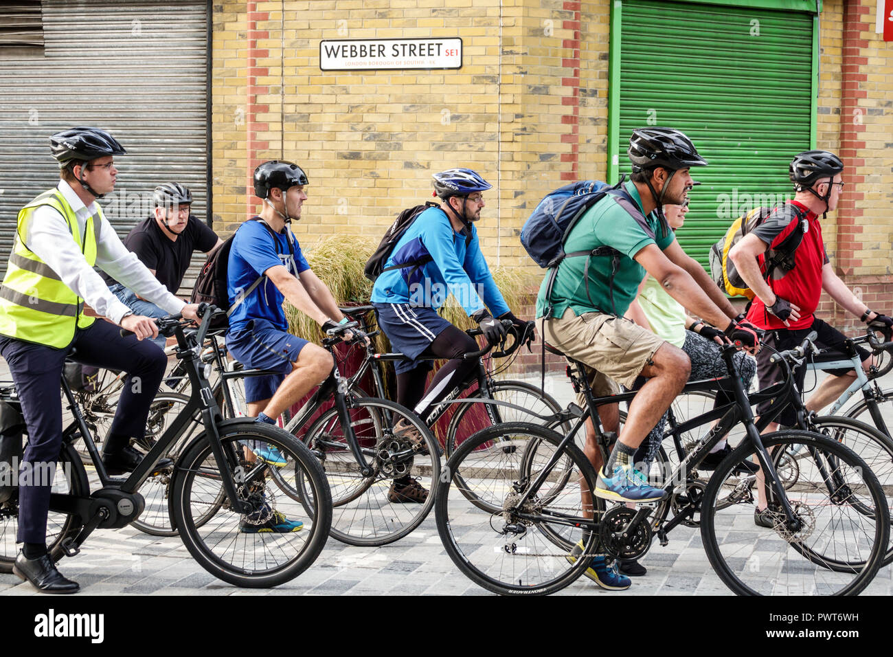 London England,UK,Lambeth,Webber Street,bicycle bicycles bicycling riding biking rider riders bike bikes,bike lane,work commuters,riding riders,bicycl Stock Photo