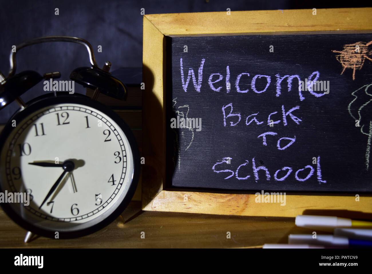 Welcome back to school message concept with quote written on chalkboard ...