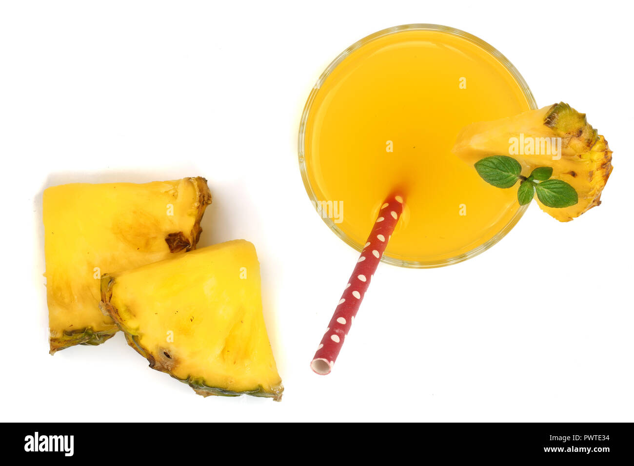 pineapple juice in a glass with pineapple slices isolated on white ...