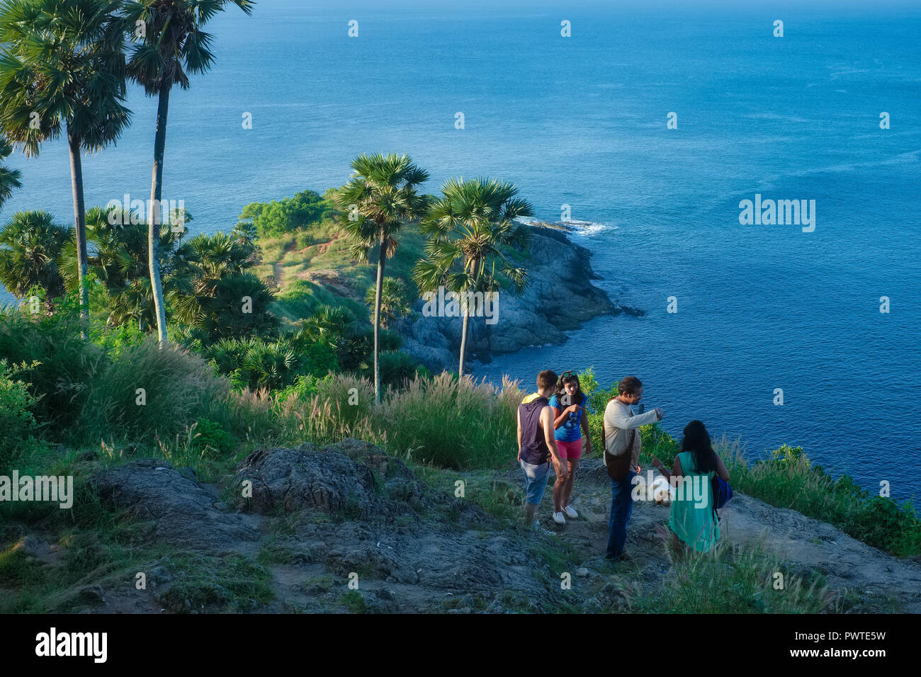 Indian tourists, on an early morning visiting Laem Phromthep or Phromthep Cape, the southernmost point on Phuket island, Thailand Stock Photo