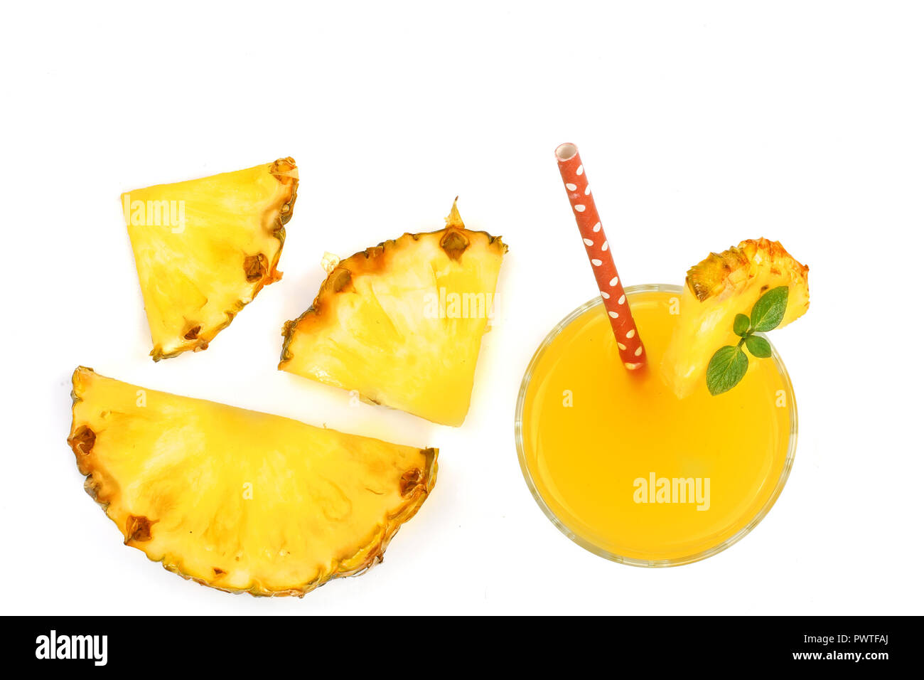 pineapple juice in a glass and pineapple slices isolated on white ...