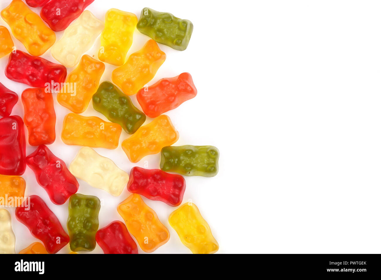 Colorful eat gummy bears jelly candy Isolated on white background with copy space for your text. Top view. Flat lay. Stock Photo