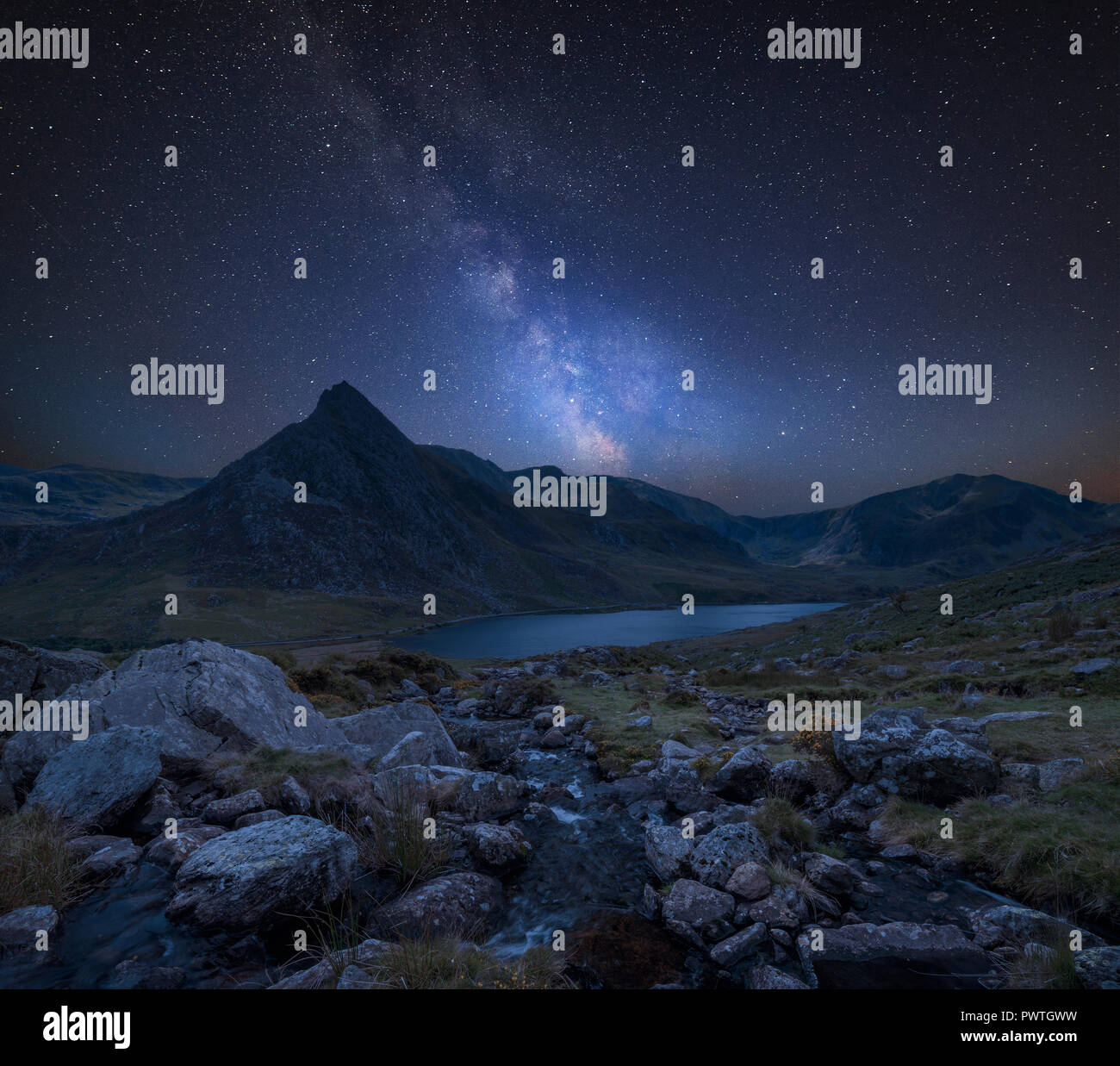 Stunning vibrant Milky Way composite image over Beautiful landscape ...