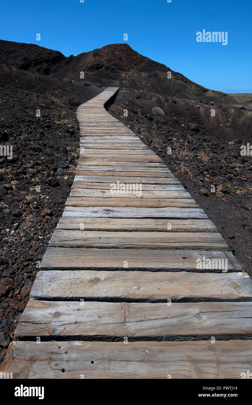 Boarded footpath through black lava field, Punta de Teno, Tenerife, Spain Stock Photo