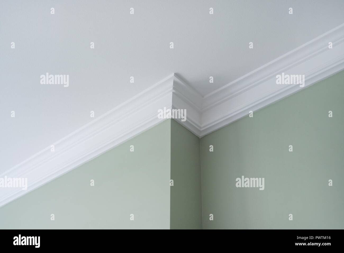 Ceiling moldings in the interior, a detail of intricate corner Stock