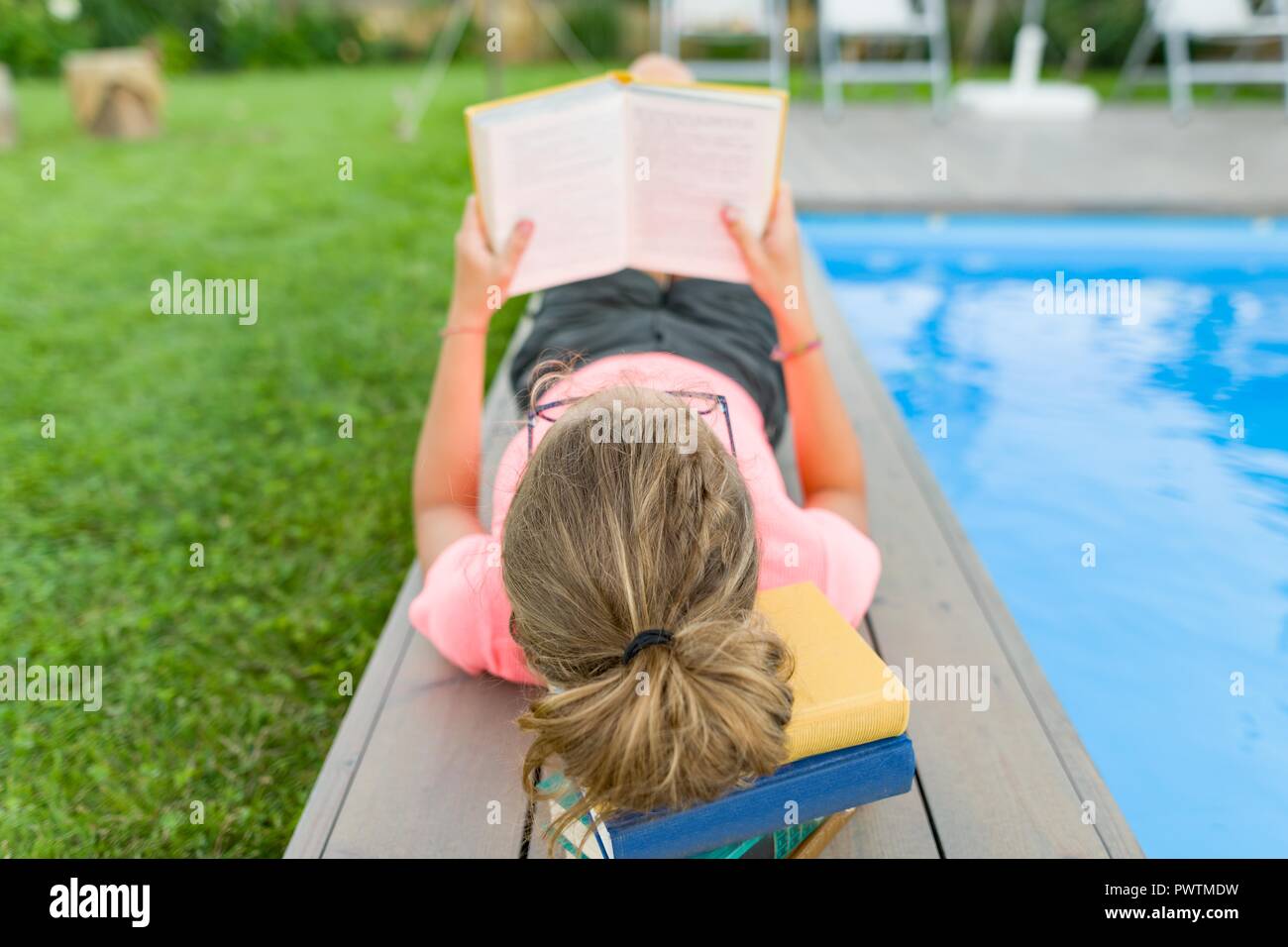 Woman Reading Book In Swimming Pool High Resolution Stock Photography And Images Alamy