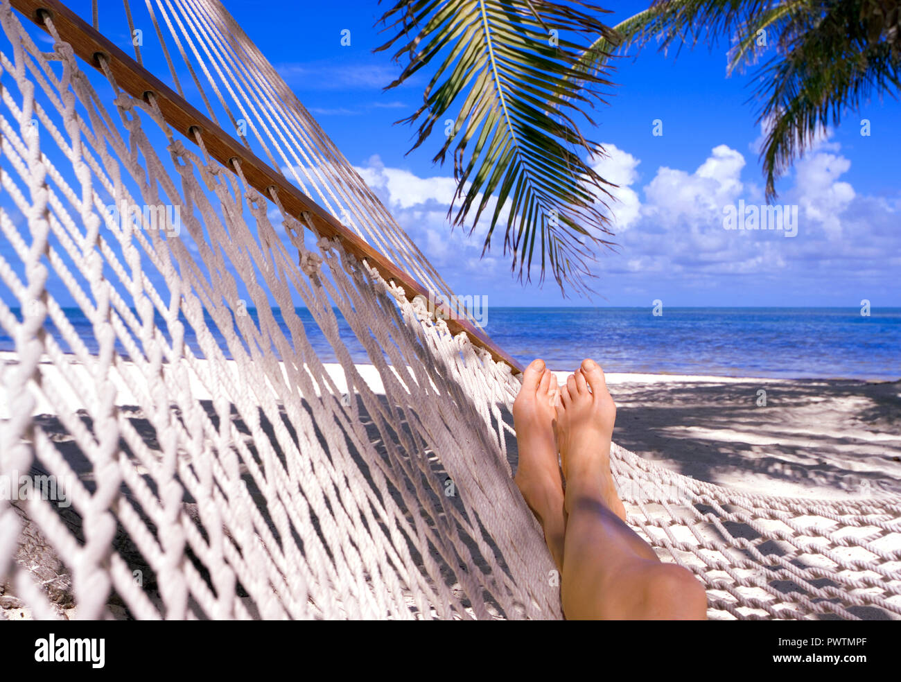 Woman relaxing on beach in Mexico Stock Photo