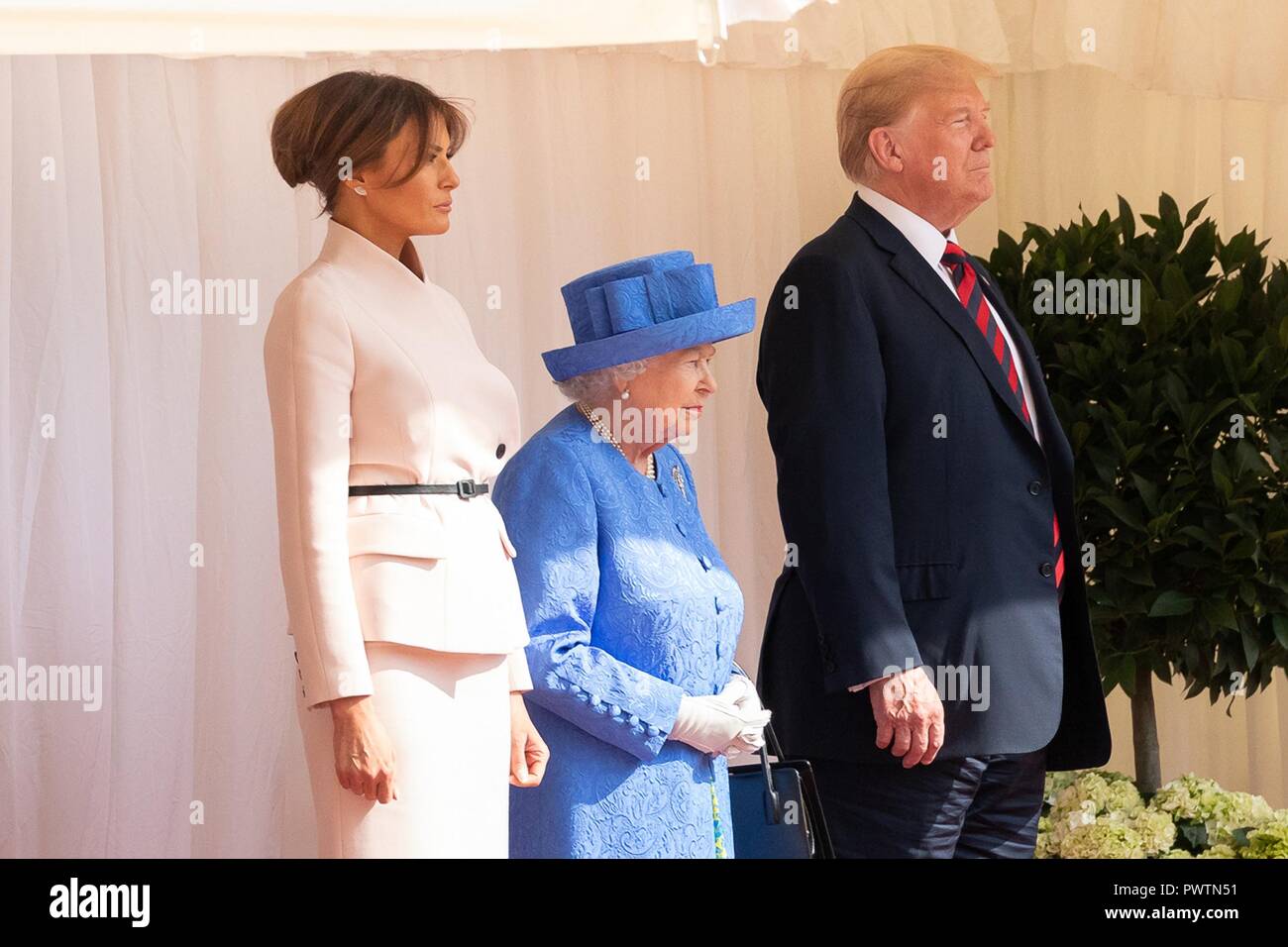 U.S First Lady Melania Trump, Her Majesty Queen Elizabeth II and President Donald Trump stand for the national anthems at Windsor Castle July 13, 2018 in Windsor, United Kingdom. Stock Photo