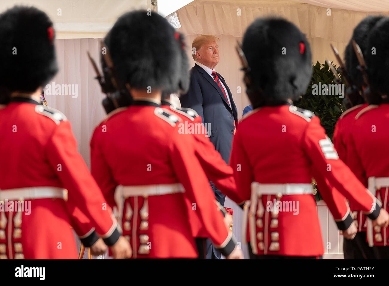 U.S President Donald Trump watches the review of troops during the formal arrival ceremony at Windsor Castle July 13, 2018 in Windsor, United Kingdom. Stock Photo