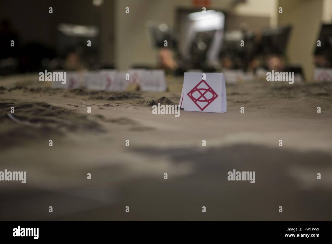 A training area terrain model is located center room at the Tactical Training Control Exercise Group Battle Simulation Center on June 19th, 2017, as U.S. Marines with 2nd battalion, 25 Marines, 4th Marine Division, Marine Forces Reserve, prepare for the final training sequence of Integrated Training Exercise 4-17, Marine Corps Air Ground Combat Center Twentynine Palms, California. ITX 4-17 is a live-fire and maneuver combined arms exercise designed to train battalion and squadron-sized units in the tactics, techniques, and procedures required to provide a sustainable and ready operational rese Stock Photo