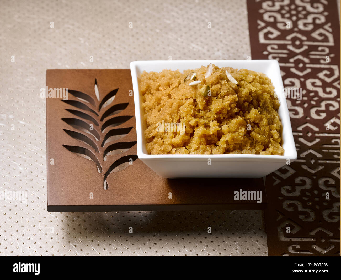 Mung Dal Sheera, AN INDIAN DESSERT MADE FROM WHEAT AND JAGGERY Stock
