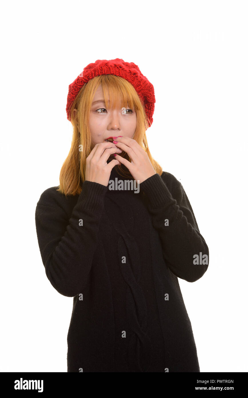 Young cute Asian woman looking scared and afraid Stock Photo