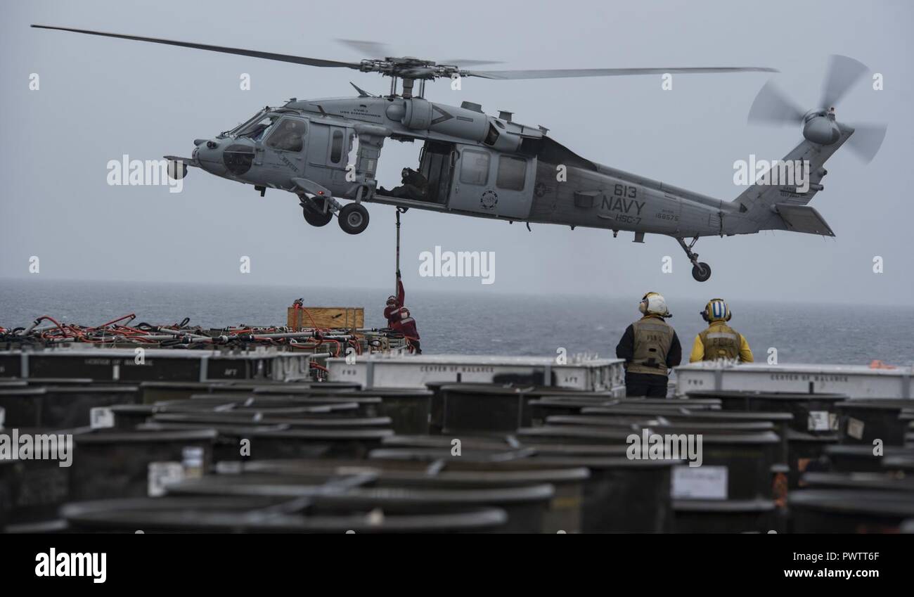 ATLANTIC OCEAN (June 21, 2017) Sailors connect a "pogo stick" to an MH ...