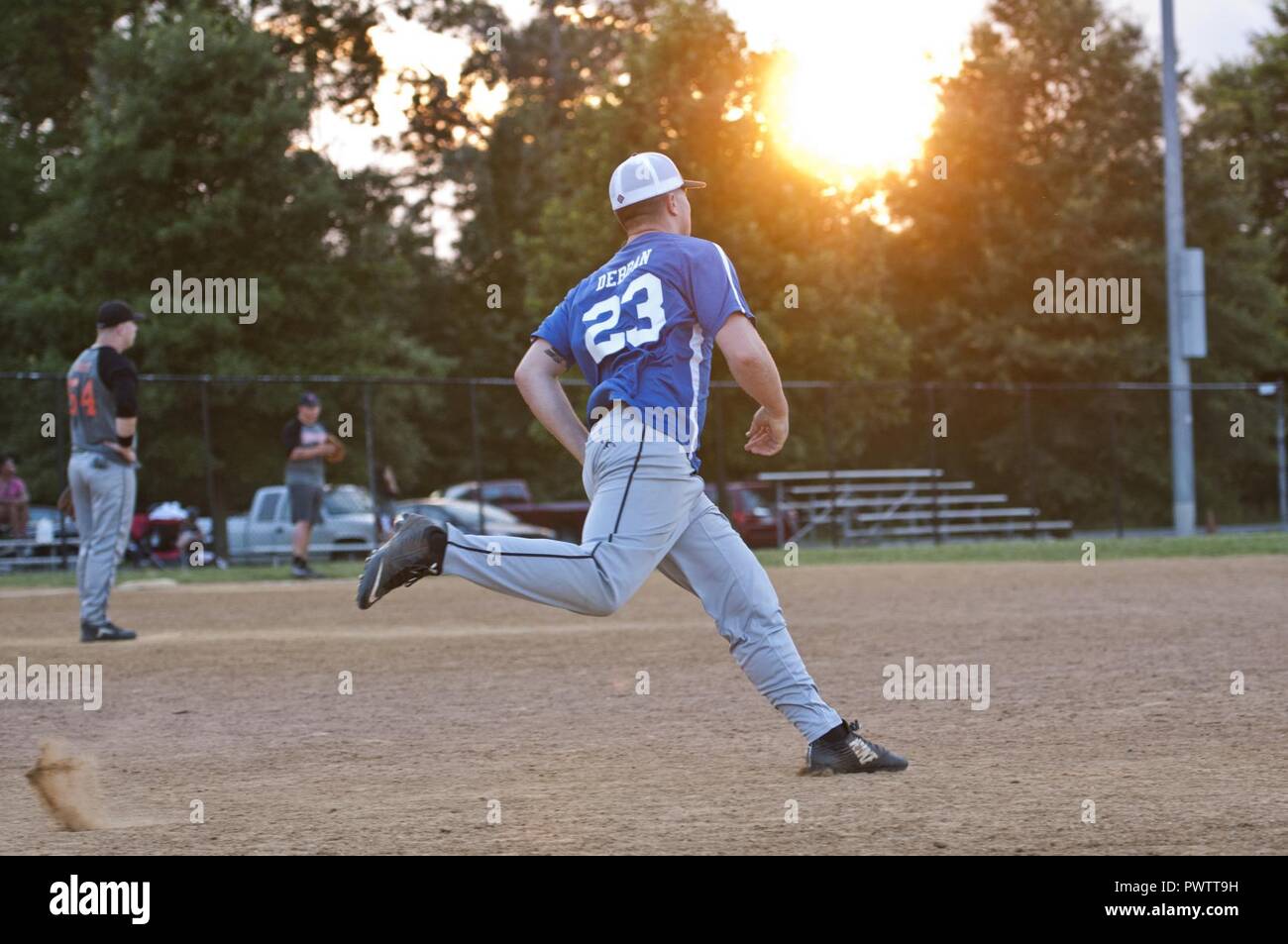 22nd Intelligence Squadron infielder rounds the bases during an Intramural Softball game against the 94th Intelligence Squadron, June 21, 2017 at Fort George G. Meade. 22nd IS won by a score of 10-0. Stock Photo
