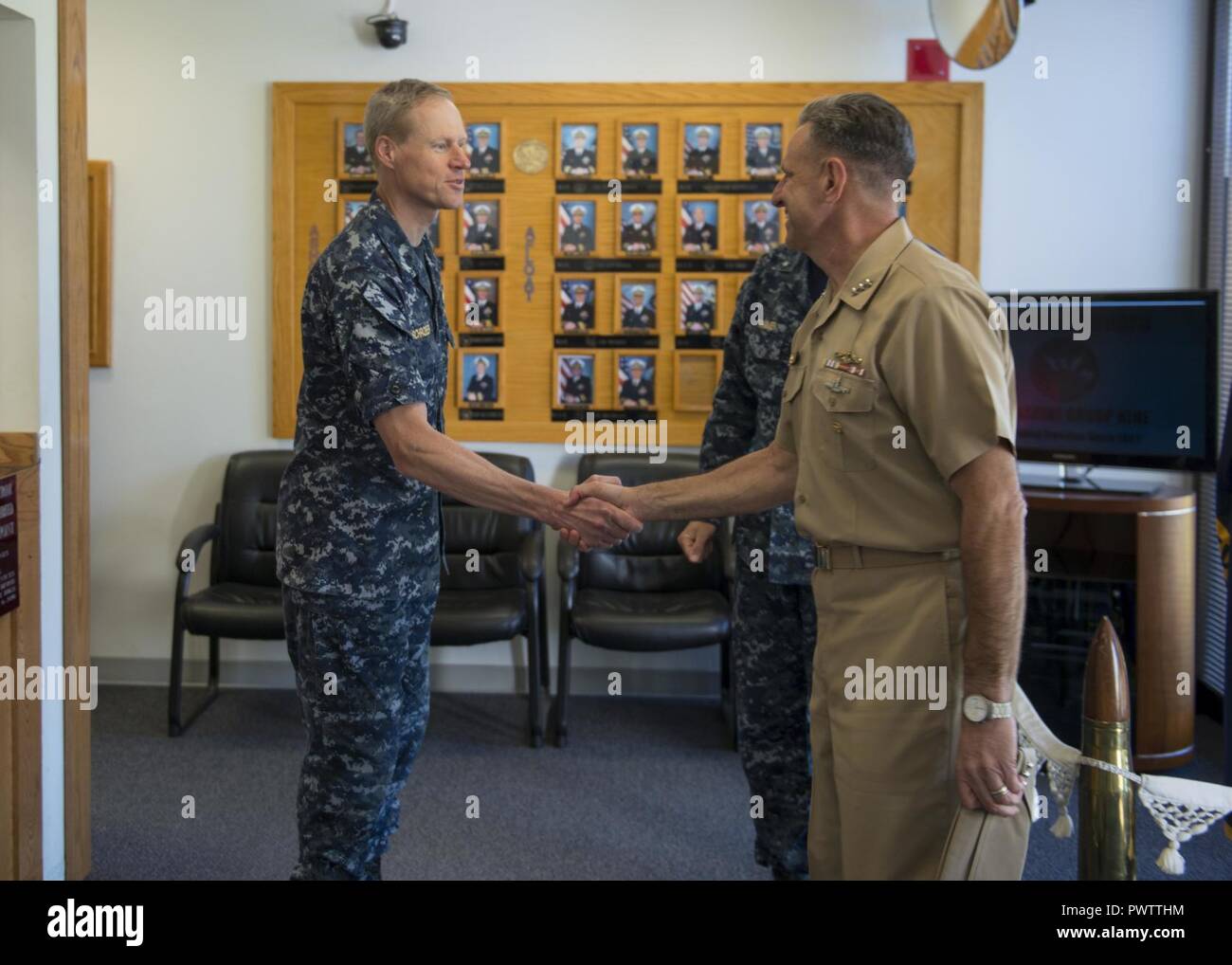 BANGOR, Wash. (June 22, 2017) Capt. Ted Schroeder, chief of staff, Submarine Group (COMSUBGRU) 9, greets Chief of Naval Personnel Vice Adm. Robert Burke on the quarterdeck of COMSUBGRU-9 while visiting Naval Base Kitsap (NBK) Bangor. During his visit, he conducted four separate all hands calls at NBK Bangor and NBK Bremerton to answer Sailor’s questions. ( Stock Photo