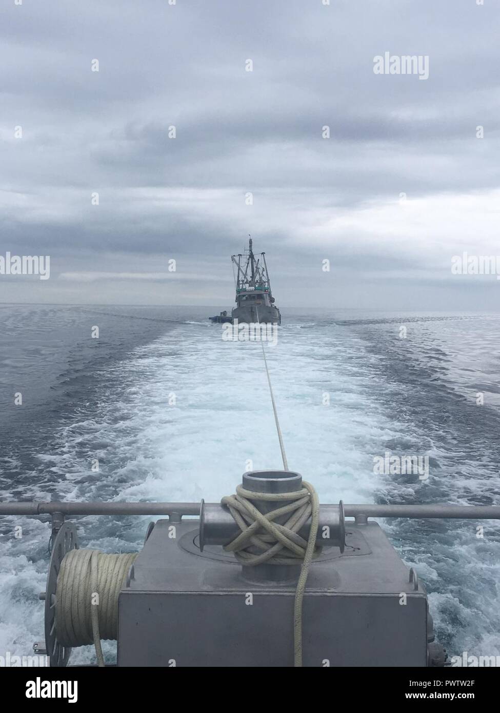 A Coast Guard Station Valdez 45foot Response BoatMedium crew tows a fishing vessel, the Kodiak